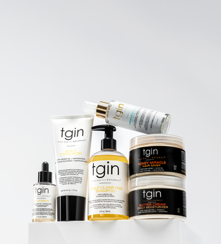 Assorted tgin products including Scalp Exfoliator, Scalp Serum, Scalp Clarifying Shampoo, Honey Miracle Hair Mask and Butter Cream Daily Moisturizer
