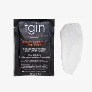 tgin Honey Miracle Hair Mask packet next to a swatch of the mask