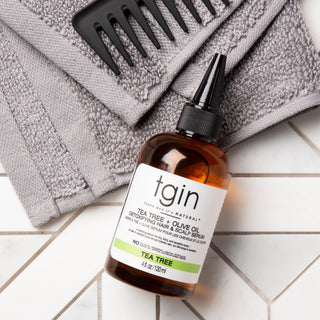 tgin tea tree serum bottle with towel and comb