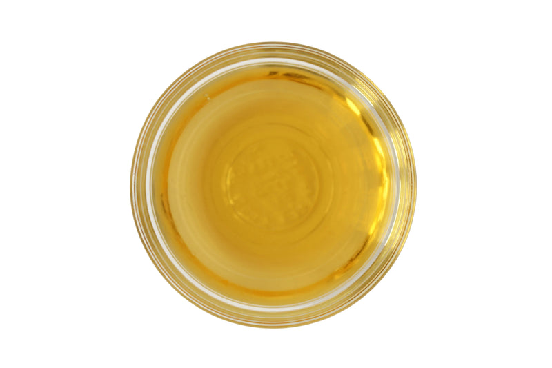 Glass bowl of golden oil