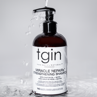 tgin Miracle RepaiRx Strengthening Shampoo pump bottle with water splashing over it