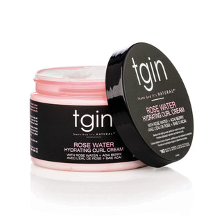 Open jar of tgin Rose Water Hydrating Curl Cream with its lid leaning on the side