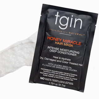 tgin Honey Miracle Hair Mask packet with a swatch of the mask
