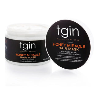 Open jar of tgin Honey Miracle Hair Mask with its lid leaning on the side