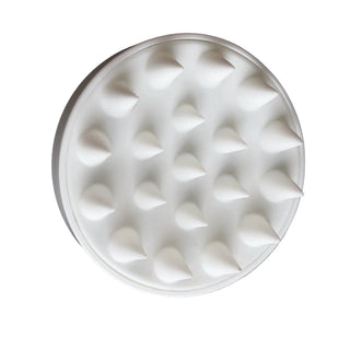 White silicone scalp massager showing its soft bristles
