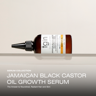 tgin Jamaican Black Castor Oil Growth Serum bottle lying on a shelf