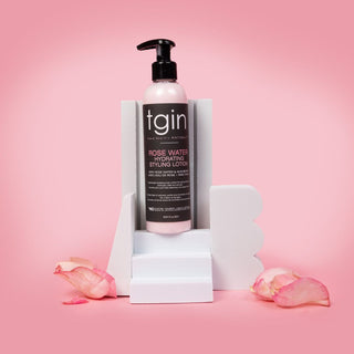 tgin Rose Water pump bottle on pink display with petals