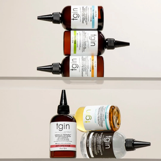 tgin serum bottles arranged on glass shelves