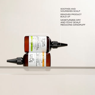 tgin Tea Tree & Olive Oil Serum bottle stacked on a Jamaican Black Castor Oil bottle with text: Soothes and nourishes scalp