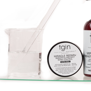 tgin Miracle RepaiRx Smooth & Protect Edge Control jar, Extra Hold, next to a glass beaker
