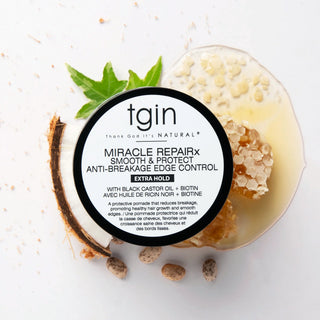 tgin Miracle RepaiRx Smooth & Protect Edge Control jar with coconut, honeycomb, and a green leaf around it