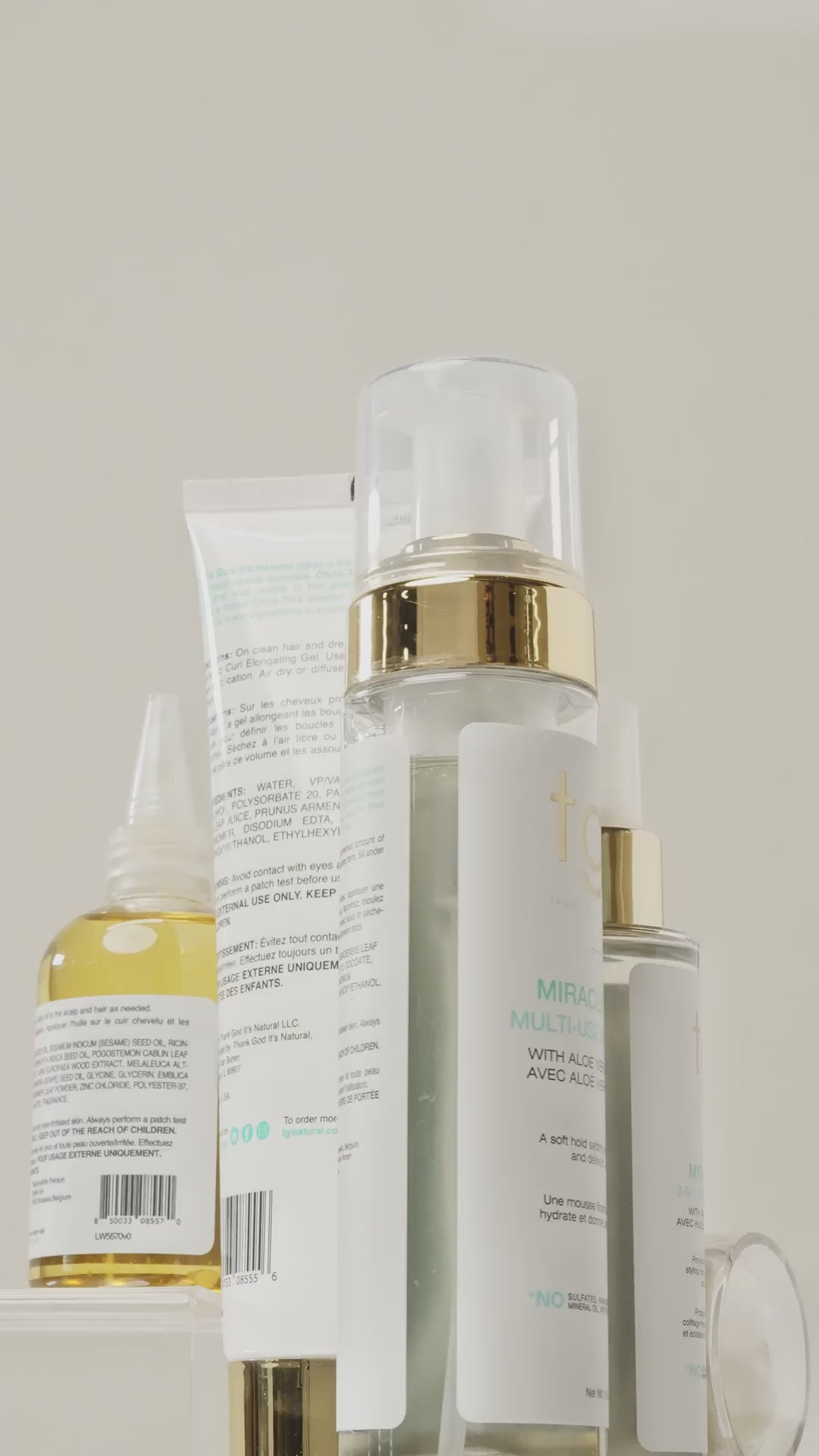 Vertical video of a tgin hair oil bottle and Butter Cream Daily Moisturizer jar