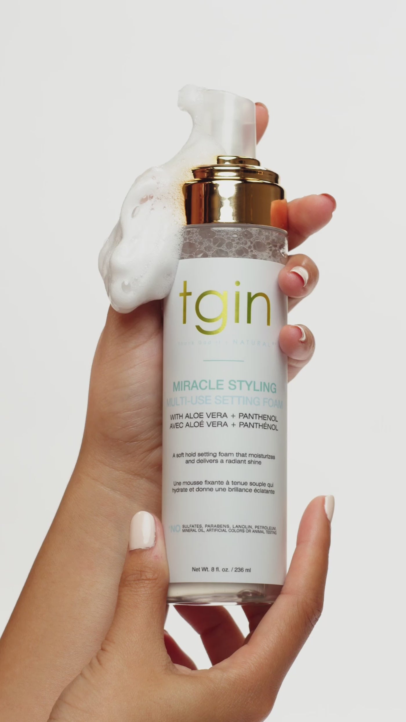 Video of tgin Miracle Styling products, including setting foam, hair oil and wax stick, shown in hand