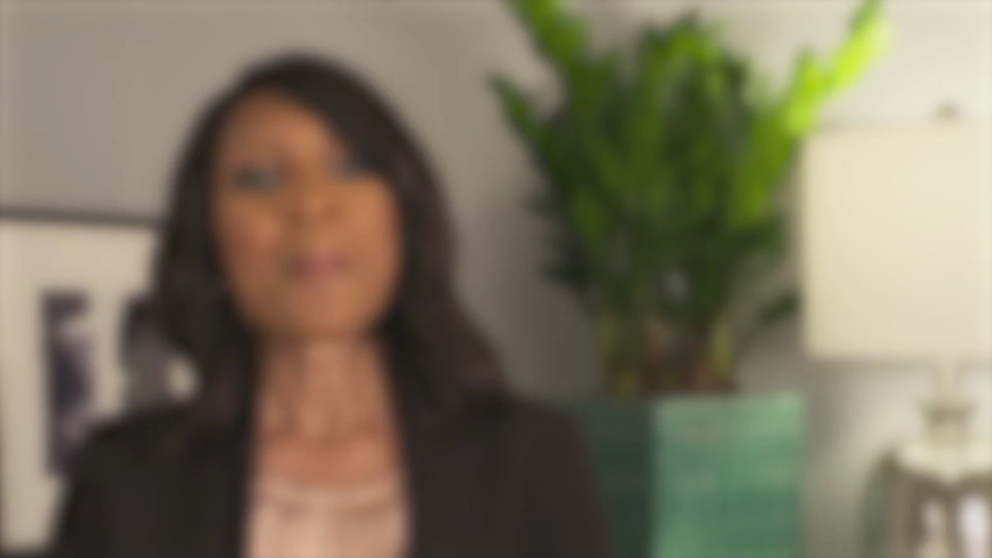Video about the tgin Foundation, opening with a woman speaking in an office with a plant behind her
