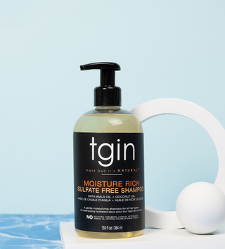 tgin Moisture Rich Sulfate Free Shampoo with a white sphere on a blue water background